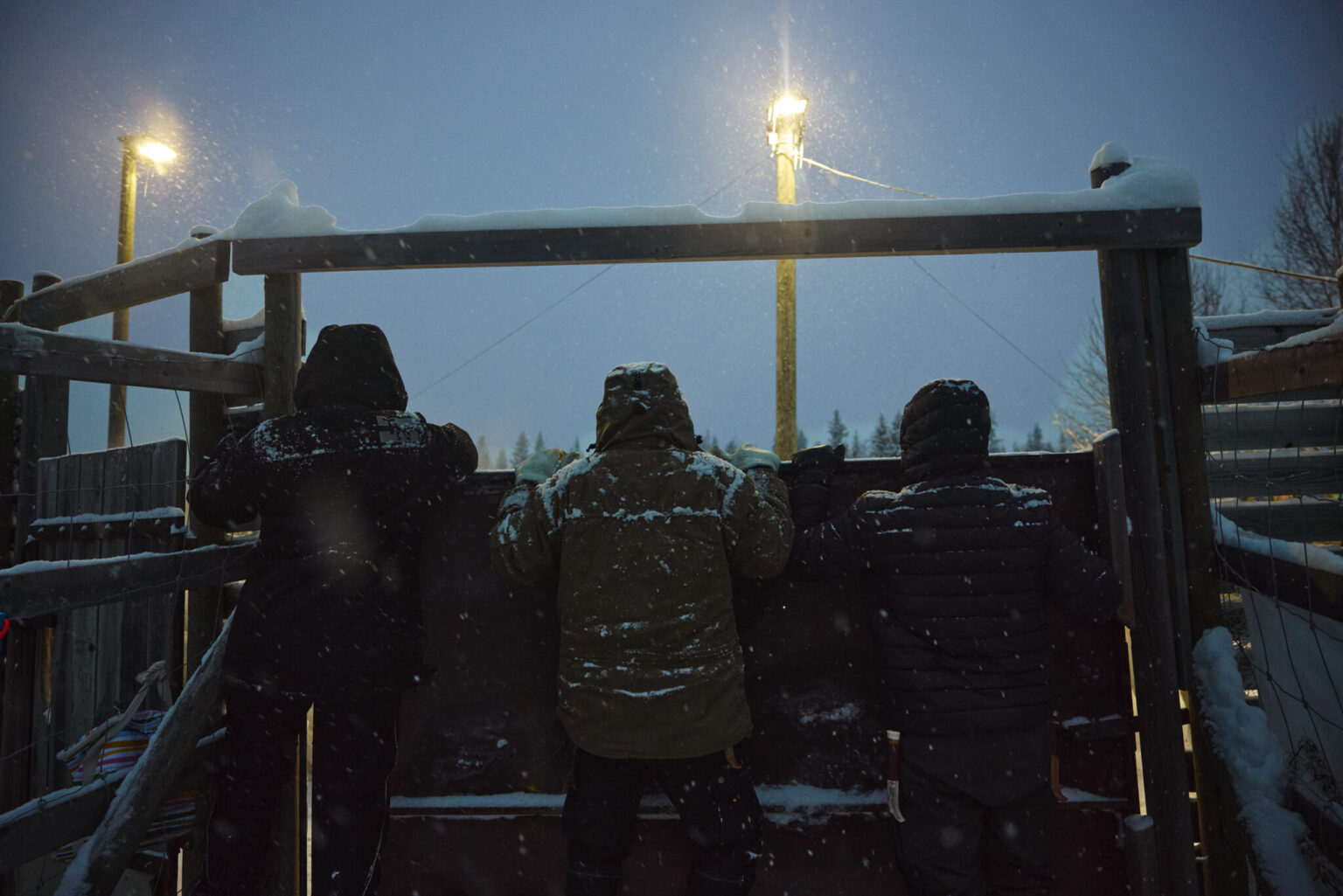a group of people standing in the snow