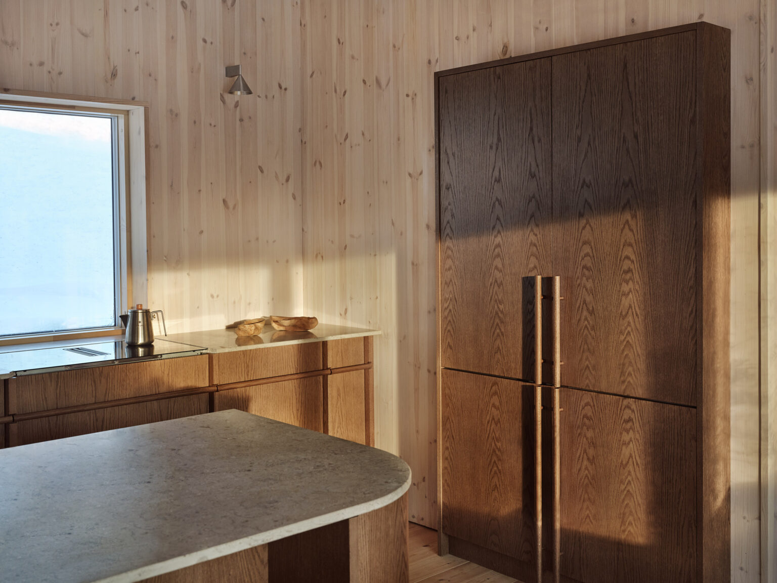 a kitchen with a wooden wall and a countertop