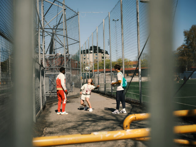 a group of people playing football