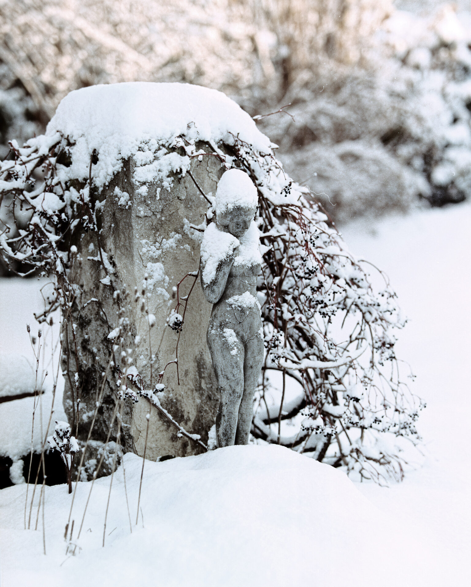 a statue in the snow
