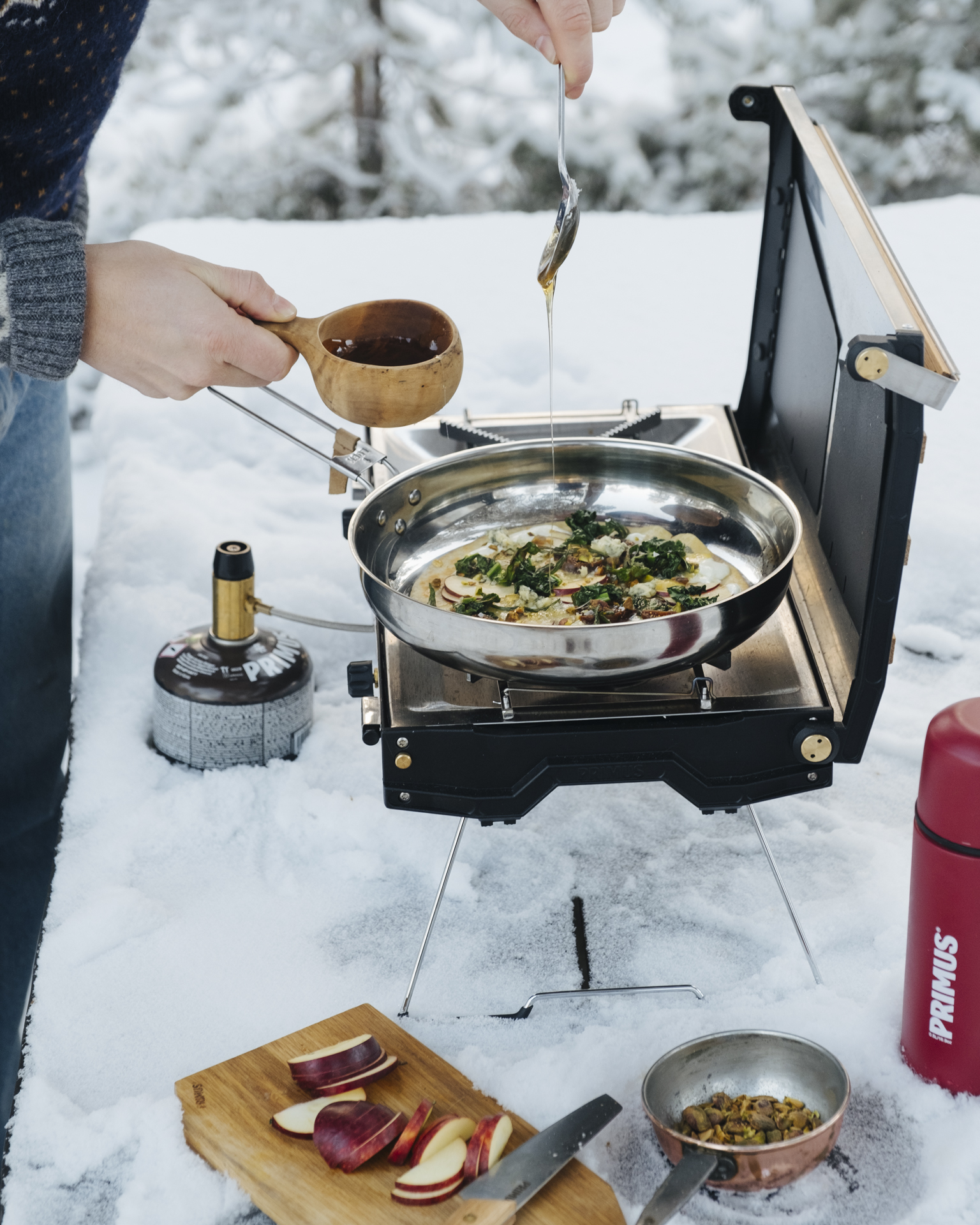 a person cooking food on a stove