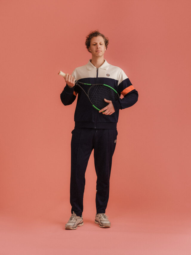 a man holding a tennis racket
