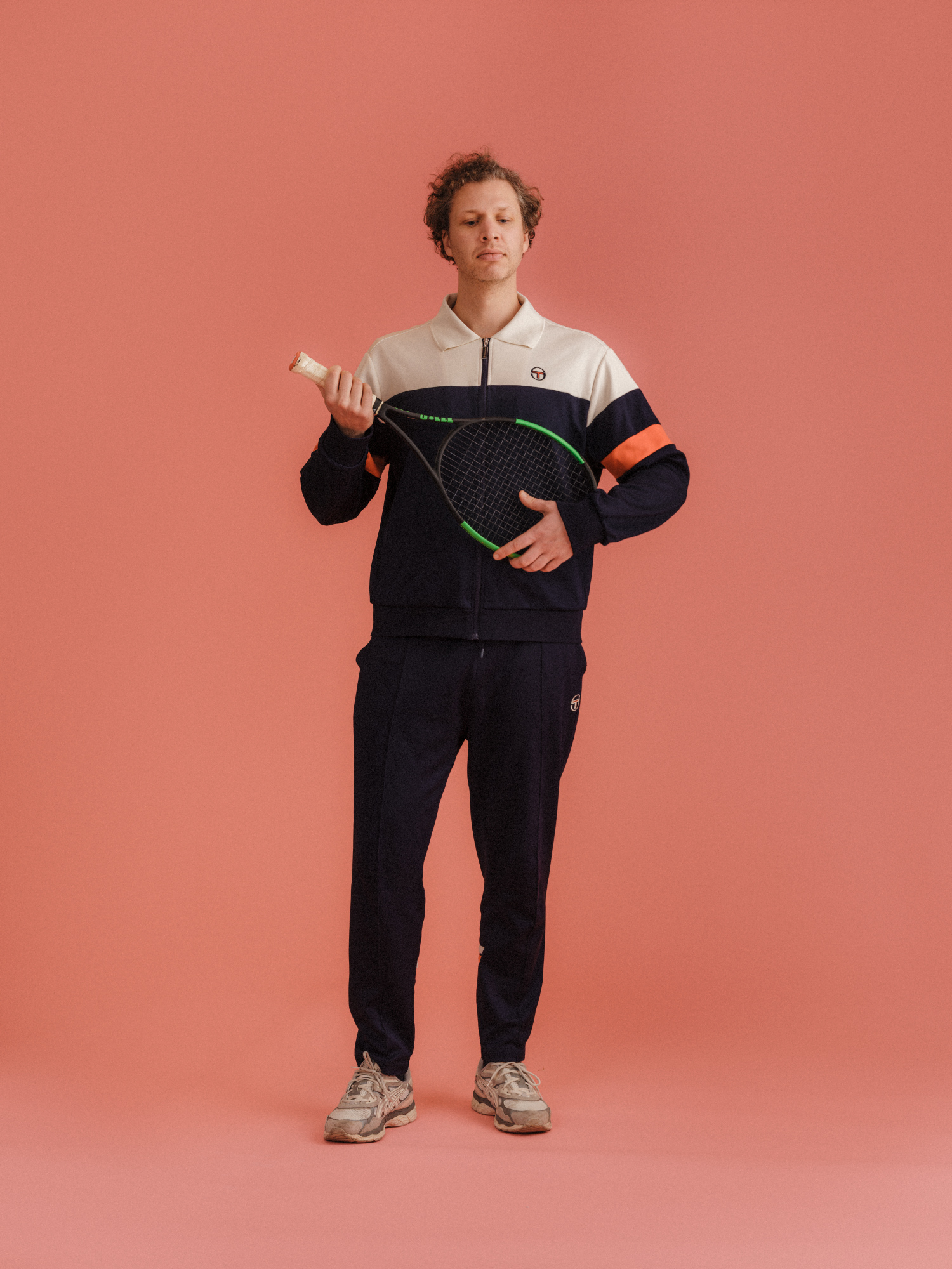 a man holding a tennis racket