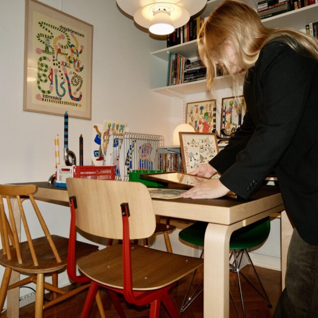 a woman standing at a table